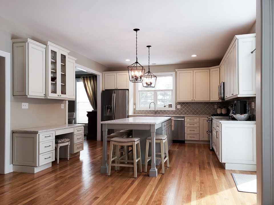 Renovated kitchen with white cabinetry